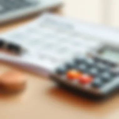 A close-up of a bank statement and calculator on a desk